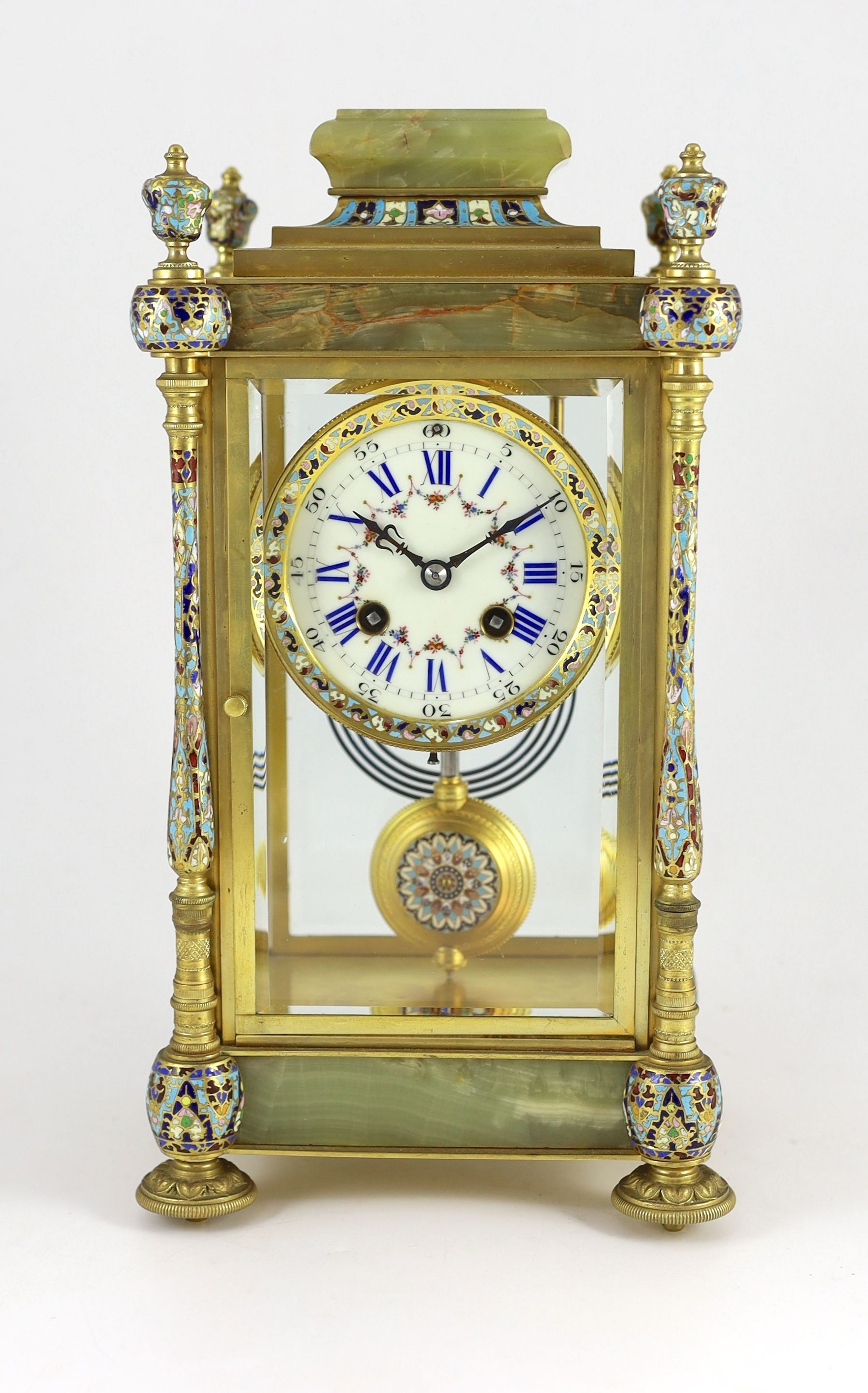 An early 20th century French ormolu and champleve enamel four glass mantel clock, width 18cm, depth 15cm, height 34cm